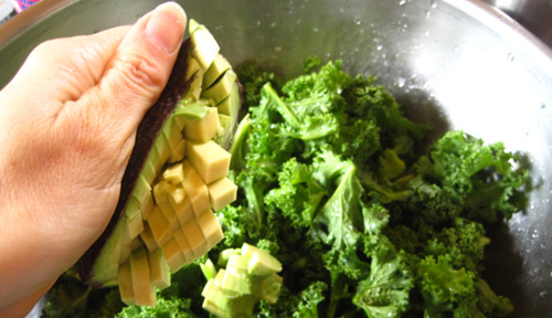 add cubed avocado to kale mix